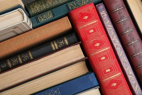 Stack of hardcover books as background, above view Stock Photos