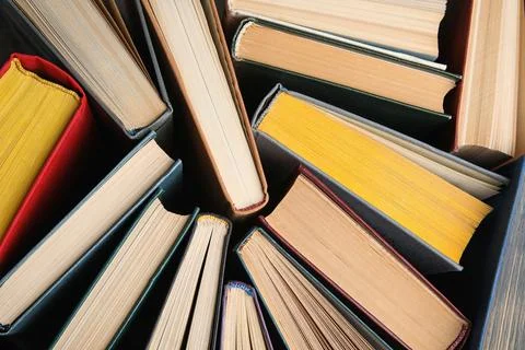 Stack of hardcover books as background, top view Stock Photos
