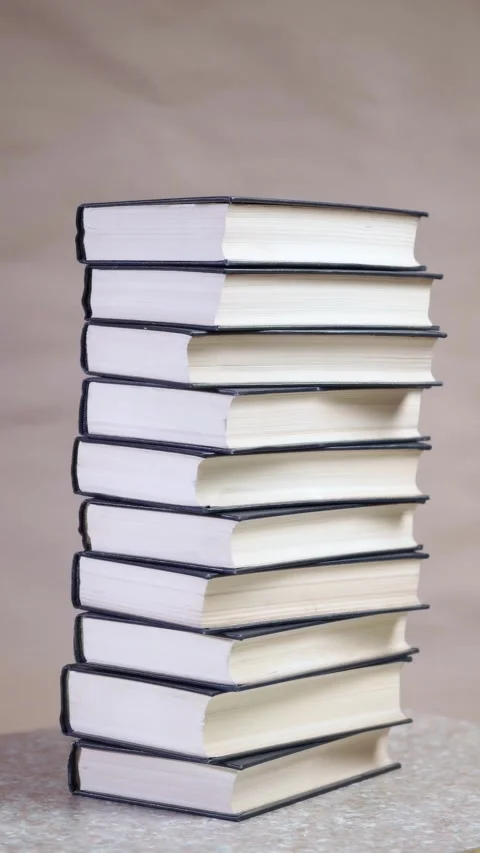 A stack of hardcover books. Collection of different books. Stock Footage 303146739