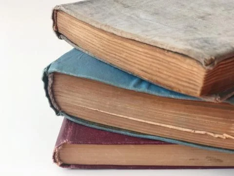 Stack of hardcovered books on white with copy space Stock Photos