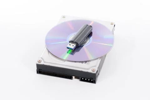 Stack of harddrive, compact disc and USB stick on white backgrou Stock Photos