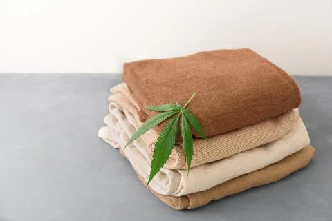 Stack of hemp clothes with leaf Stock Photos