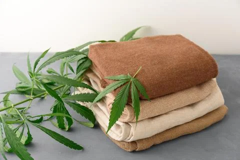 Stack of hemp clothes with leaves Stock Photos