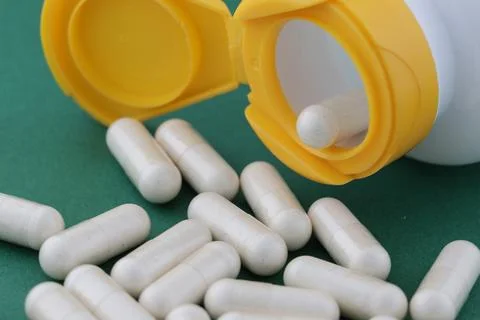 A stack of herbal capsule, dietary supplement, vitamin tablet,herbal medicine Stock Photos