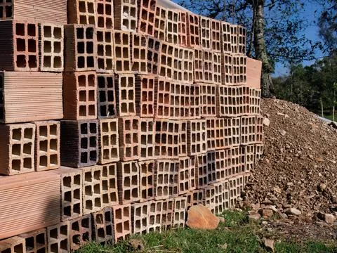 A stack of hollow clay blocks in a construction site, in a farm in the easter Stock Photos