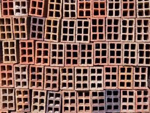 A stack of hollow clay blocks in a construction site, in a farm in the easter Foto stock