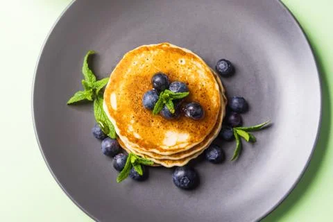 Stack of home made pancakes with fresh berries Stock Photos