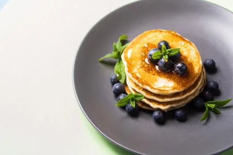 Stack of home made pancakes with fresh berries Stock Photos