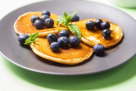 Stack of home made pancakes with fresh berries Stock Photos