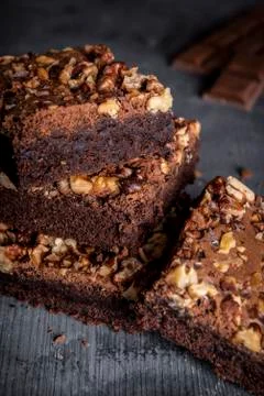 Stack of homemade brownies cake with a lot of walnuts Stock Photos