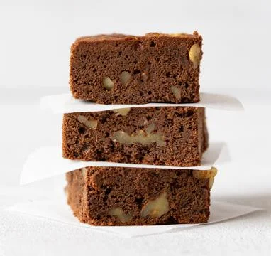 Stack of homemade chocolate cake, brownie with nuts. Macro photo Stock Photos
