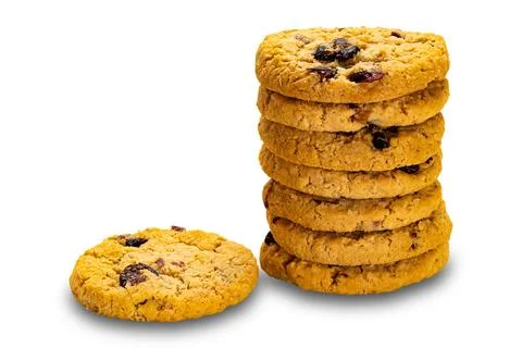 Stack of homemade circular oat flakes and cranberry biscuits. Stock Photos