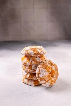 Stack of homemade crinkle cookies dusted with powdered sugar 스톡 사진