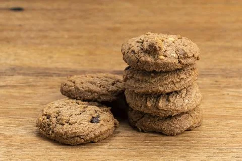 Stack of homemade delicious chocolate chip butter cookies on wooden table. Side 스톡 사진