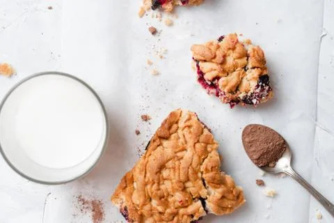 Stack of homemade pieces of cake with fresh jam. Stock Photos