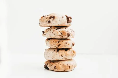 Stack of homemade vegan chocolate chip cookies on white background Stock Photos