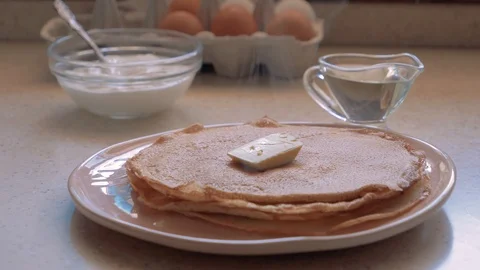 Stack of hot classic Russian thin pancakes. Butter thaws on a stack of pancakes. Stock Footage 112912632