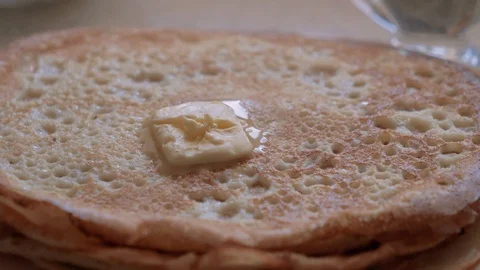 Stack of hot classic Russian thin pancakes. Butter thaws on a stack of pancakes. Stock-Footage 112912752