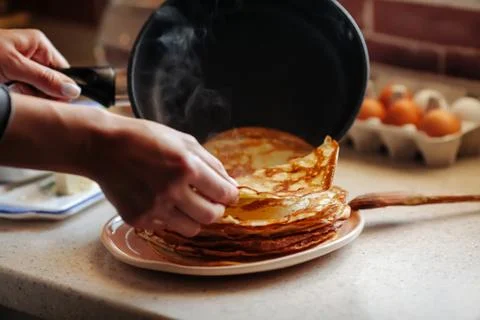 Stack of hot classic Russian thin pancakes. Rustic style. Traditional for the Stock Photos