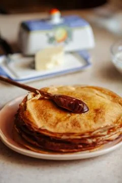 Stack of hot classic Russian thin pancakes. Rustic style. Traditional for the Stock Photos