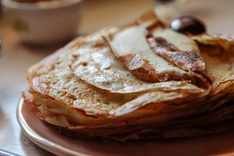 Stack of hot classic Russian thin pancakes. Rustic style. Traditional for the Stock Photos