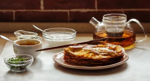 Stack of hot classic Russian thin pancakes. Rustic style. Traditional for the Stock Photos