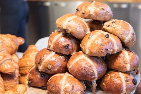 Stack of Hot Cross buns in bakery Stock Photos