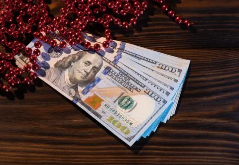 Stack Of Hundred-Dollar Banknotes gift for the new year or christmas. flat la Stock Photos