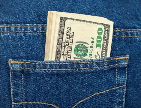 Stack of hundred dollar bills in the back jeans pocket Stock Photos