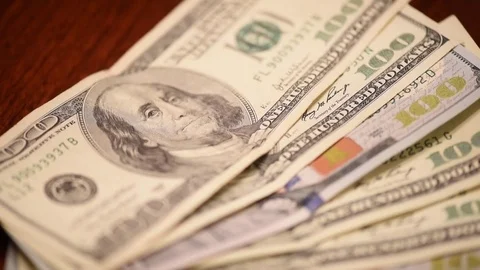 Stack hundred dollar bills into focus Stock Footage 75763642