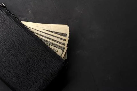 Stack of hundred-dollar bills lies on wallet Stock Photos
