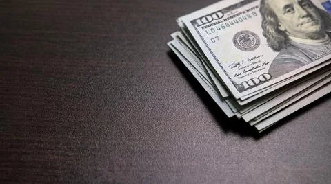 Stack of hundred-dollar bills on table 스톡 사진