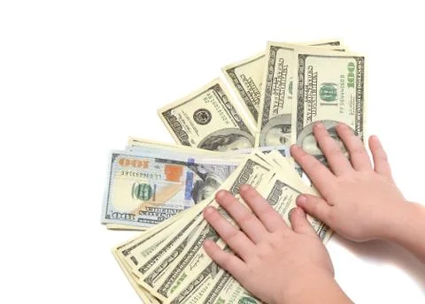 A stack of hundred dollar bills on white isolated background with children's Stock Photos