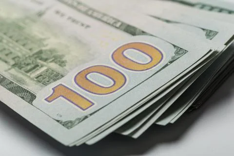 Stack of hundred dollars isolated on white Stock Photos