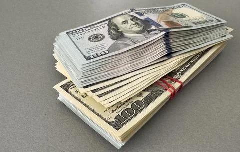 Stack of hundred dollars isolated on white Stock Photos