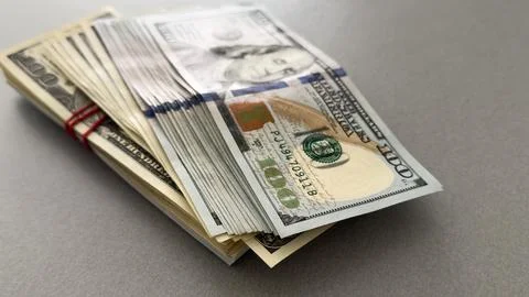 Stack of hundred dollars isolated on white Stock Photos