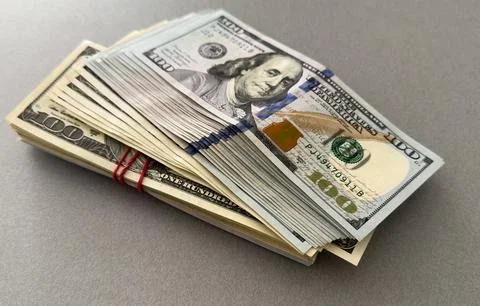 Stack of hundred dollars isolated on white Stock Photos