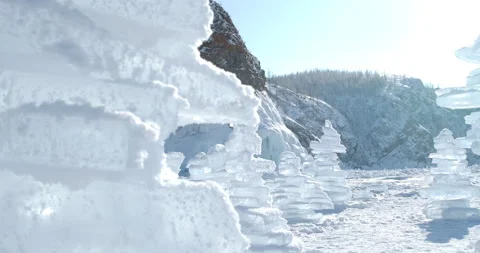 A stack of ice floe crystals on the surface of a frozen Lake Baikal in winter.  Stock Footage 143444227
