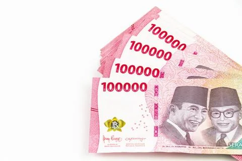 Stack of Indonesian 100,000 Rupiah Banknotes Isolated on White Background Stock Photos