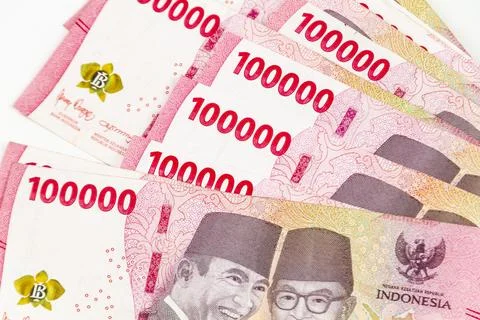 Stack of Indonesian 100,000 Rupiah Banknotes Isolated on White Background Фото