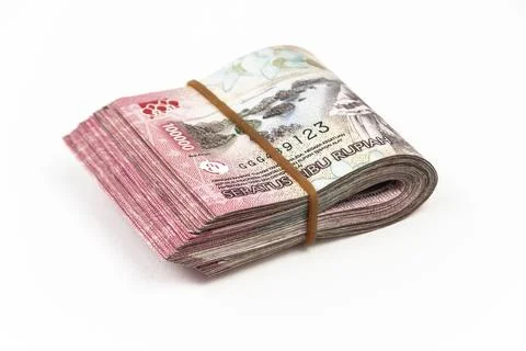 Stack of Indonesian 100,000 Rupiah Banknotes Isolated on White Background Stock Photos