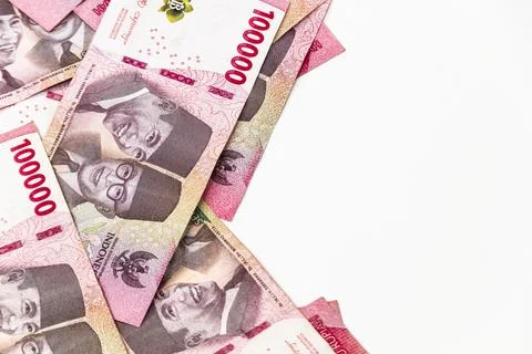 Stack of Indonesian 100,000 Rupiah Banknotes Isolated on White Background Фото