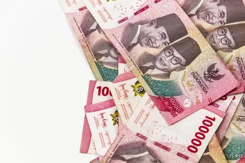 Stack of Indonesian 100,000 Rupiah Banknotes Isolated on White Background Stock Photos