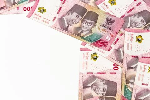 Stack of Indonesian 100,000 Rupiah Banknotes Isolated on White Background Stock Photos