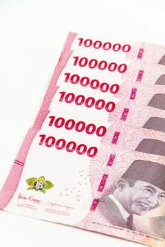 Stack of Indonesian 100,000 Rupiah Banknotes Isolated on White Background Stock Photos