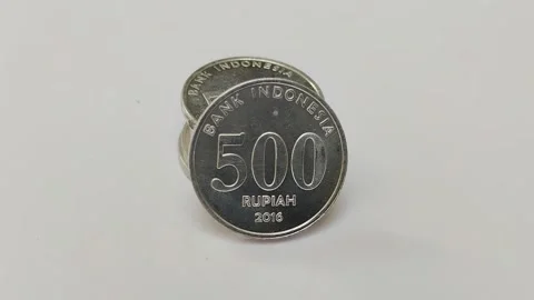 A stack of Indonesian currency made of metal on a white background Stock Footage 285591986