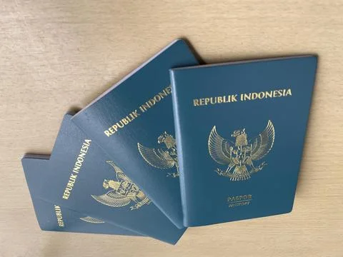 Stack of Indonesian green passports on a table with copy space Stock Photos