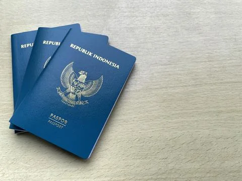 Stack of Indonesian green passports on a table with copy space Stock-Fotos
