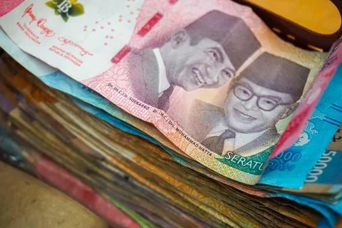 Stack of Indonesian rupiah banknotes showcasing various denominations Stock Photos