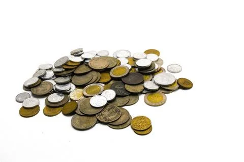 Stack of Indonesian rupiah coins of various denominations on a white backgrou Stock Photos